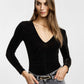 Top aderente con scollo a v e maniche lunghe