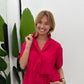 Camicia boxy con tasca frontale e maniche corte