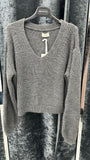 maglia di lana con scollo a v con manica morbida  lunga