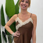 Top asimmetrico con pizzo e spalline sottili