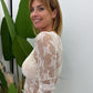 Top trasparente a maniche lunghe con ricamo floreale