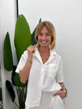 Camicia boxy con tasca frontale e maniche corte