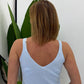Top con spalline e abbottonatura frontale